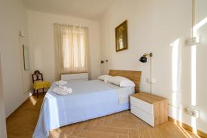 a bedroom with a bed with two pillows on it at Casa Francesco in Pizzo
