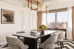 a dining room with a table and chairs at Rosewood Villa Magna in Madrid