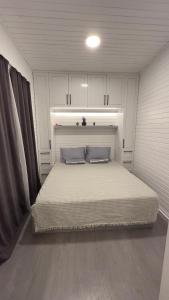 מיטה או מיטות בחדר ב-Tiny House Sitesi