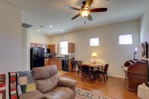 a living room with a couch and a ceiling fan at Tucson Home with Private Pool and Mountain Views! in Catalina