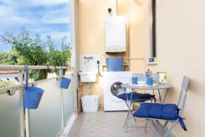 Η κουζίνα ή μικρή κουζίνα στο Fronte Mura Lucca [Free Parking][WI-FI][AC]