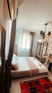 Postel nebo postele na pokoji v ubytování ALAÇATI XL LUXURY HOTEL