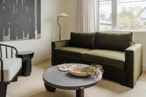 a living room with a couch and a table at Sonder Ceros in Denver