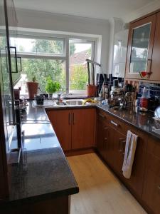 a kitchen with a sink and a window at Beautiful and peaceful large double bedroom near Olympic Park in Stratford London in London