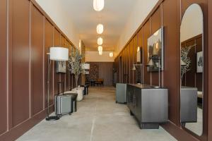 a hallway with a hotel lobby with a vanity and sinks at Sonder Ceros in Denver