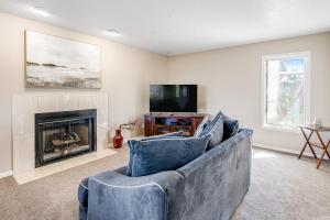a living room with a couch and a fireplace at Southern Utah Realness in St. George
