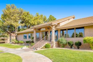a house with a porch and a lawn at Southern Utah Realness in St. George