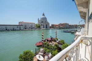 a balcony with a view of the river in venice at The St. Regis Venice in Venice
