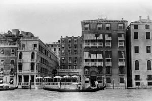 a boat on the water in front of buildings at The St. Regis Venice in Venice +137 photos