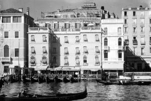 a group of gondolas in front of a building at The St. Regis Venice in Venice