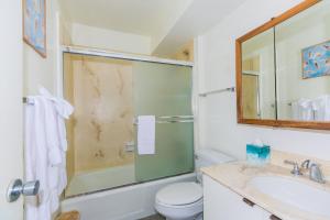 a bathroom with a shower and a toilet and a sink at Ilikai Marina 1495 in Honolulu