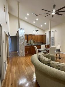a living room with a couch and a table at tropical bay house in Englewood