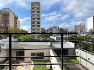 a view of a city from a balcony at Edificio 9 de Julio in San Miguel de Tucumán