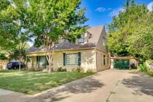 a house with a driveway and a garage at Spacious Amarillo Home with Shared Fire Pit! in Amarillo