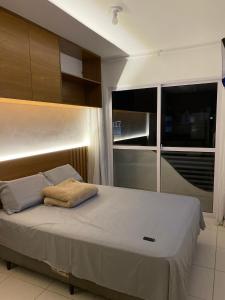 a bedroom with a large bed in a room at Flat em Campina Grande in Campina Grande