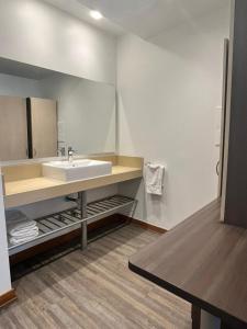 a bathroom with a sink and a mirror at BHB Hotel Boutique in Santiago