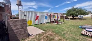 a building with a mural on the side of it at A la sombra del calden in Santa Rosa