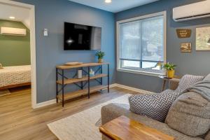 a living room with a couch and a bed at Dog-Friendly Mills River Retreat Near Hiking! in Mills River