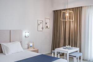 Säng eller sängar i ett rum på Sea View Hotel & Apartments