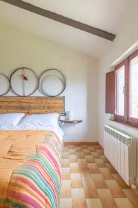 Säng eller sängar i ett rum på La fonte di Gaiche