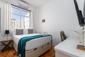 A bed or beds in a room at Charme em Botafogo - Ambiente acolhedor - VLP611 Z5