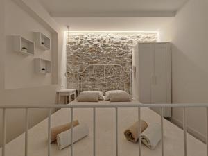 Giường trong phòng chung tại Apartments Mateo