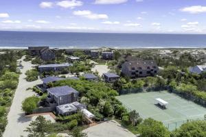 an aerial view of a house with a tennis court at Unit 1723 Ocean Colony Beach in Amagansett