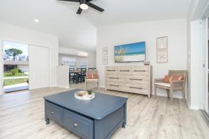 a living room with a blue coffee table in the middle at Beautiful Spacious Home! Close to Beaches - HEATED Private Pool in Englewood