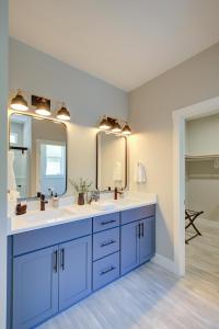 a bathroom with two sinks and two mirrors at Amongst The Waves in Ocean Shores +32 photos