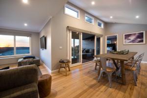 a living room with a table and a couch at Quartz Retreat in Daylesford