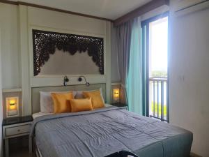 Ένα ή περισσότερα κρεβάτια σε δωμάτιο στο At Laguna Phuket Apartment +78 φωτογραφίες