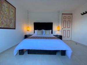 Voodi või voodid majutusasutuse Mahalo Hostel toas