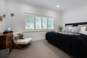 Ένα ή περισσότερα κρεβάτια σε δωμάτιο στο Sandringham +14 φωτογραφίες