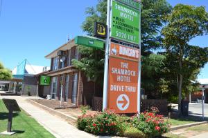 a street sign on a pole in front of a building at The Shamrock Hotel Balranald in Balranald