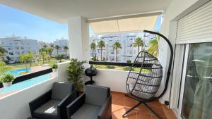 Bazén v ubytování Apartamento en Resort De Golf nebo v jeho okolí
