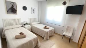 Postel nebo postele na pokoji v ubytování Apartamento en Resort De Golf