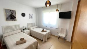 Postel nebo postele na pokoji v ubytování Apartamento en Resort De Golf