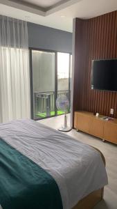 Кровать или кровати в номере Khách sạn Chè yến Nha Trang