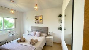 Postel nebo postele na pokoji v ubytování Apartamento en Resort De Golf + 36 fotografií