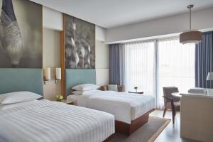 Courtyard by Marriott Bali Seminyak Resort客房内的一张或多张床位