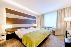 Letto o letti in una camera di Parc Hotel Alvisse