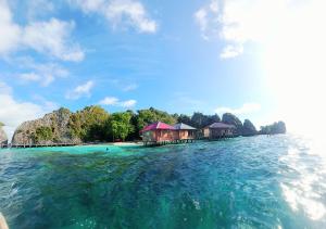 a view of a resort in the water at Nuttonton Homes in Papas