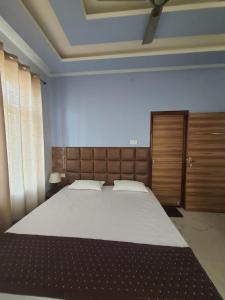 Postel nebo postele na pokoji v ubytování Shree Nanda Guest House