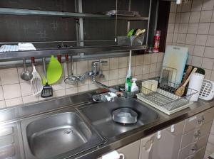 Kuchyň nebo kuchyňský kout v ubytování 百年町家 佐野邸