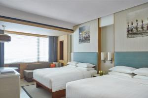 Courtyard by Marriott Bali Seminyak Resort客房内的一张或多张床位