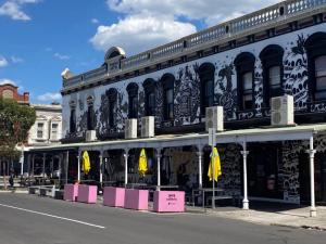 a large building with graffiti on it on a street at StayCentral - Brunswick Central Townhouse in Melbourne