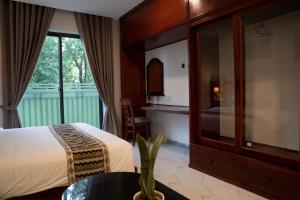 Postel nebo postele na pokoji v ubytování Marvelinn Siem Reap