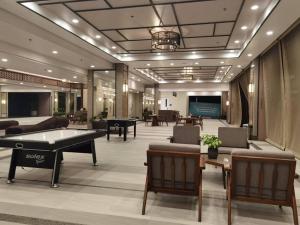 a lobby with a pool table and ping pong tables at Infina Towers Cozy 2bedroom Condo in Manila
