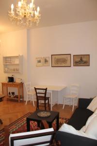a living room with a couch and a table and chairs at Premarental in Vienna