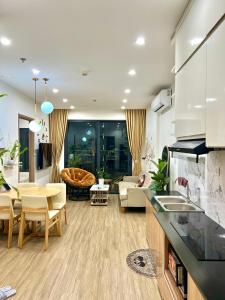 a kitchen and living room with a couch and a table at Smart homestay in Hanoi